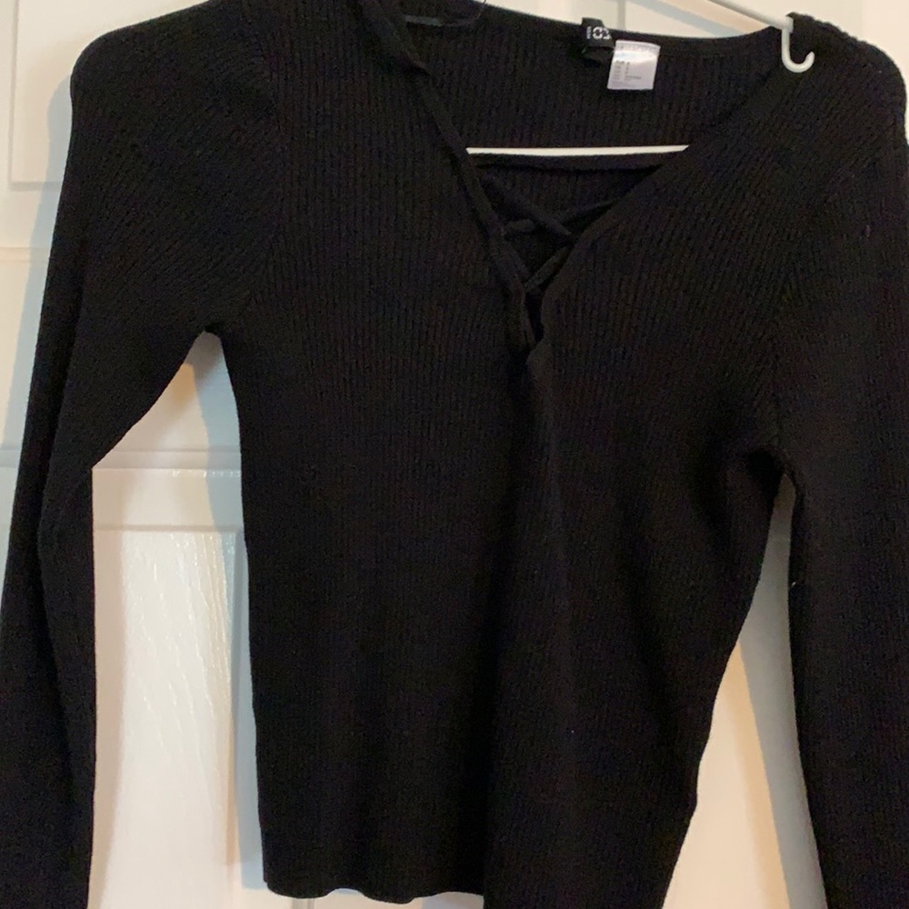 Black criss cross sweater in front
